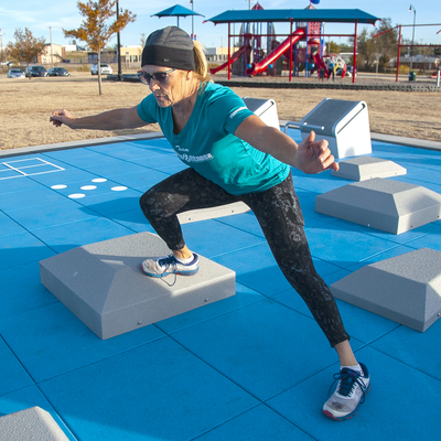 Front shot of instructor showing an exercise on Fitness Court