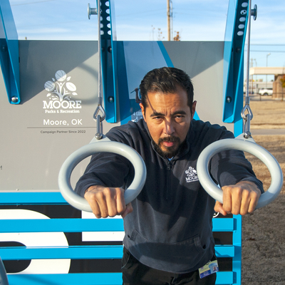 Person using rings on Fitness Court